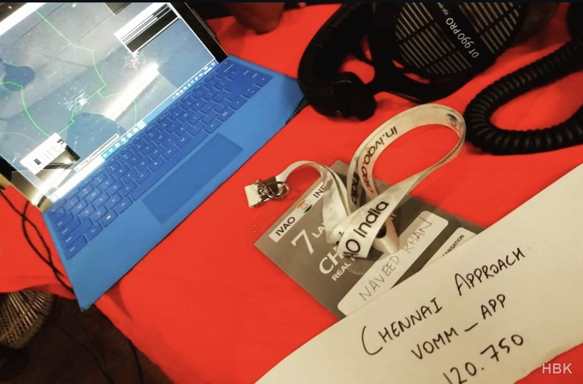 Laptop, headset and IVAO India materials at a flight-simulation setup